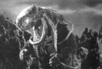 Film frame: Oodaku wraps itself around Kong's head